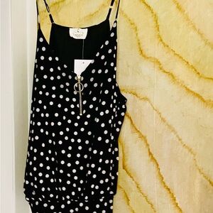 Polka dot bodysuit. Snapped crotch.